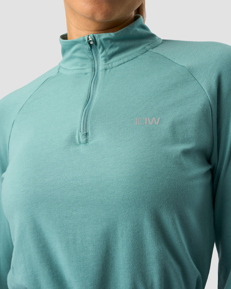 define cropped 1/4 zip adjustable mineral green